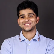 Vidyut Sriram, smiling, in a light blue polo